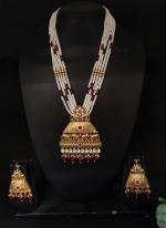 Kundan Necklace Set With White Beaded Threading and Purple Stones And Matching Earrings