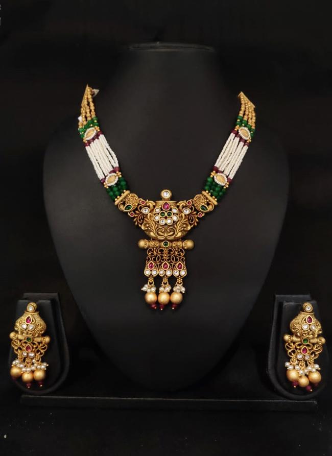 Gold Plated Kundan Necklace Set With White Beaded Threading and Purple Stones And Matching Earrings