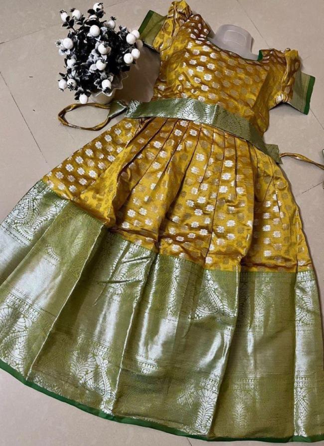 Yellow Soft Banarasi Traditional Wear Kanchi Border Work Kids Wear Readymade Gown With Belt